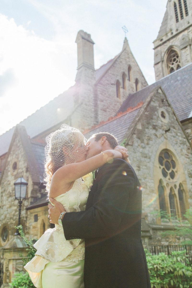 Bride and Groom sunshine kiss