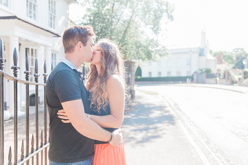 Couple kissing in the sunshine on the West Malling High Street