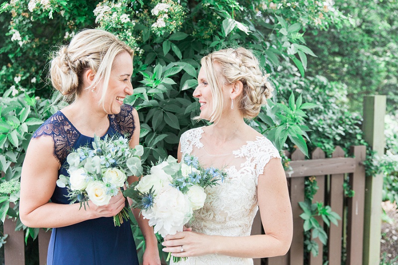 Bride and Bridesmaid Laughing in the Garden