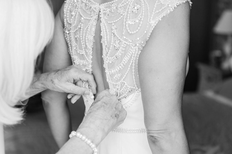 Bride Getting into Her Beaded Maggie Sottero Gown