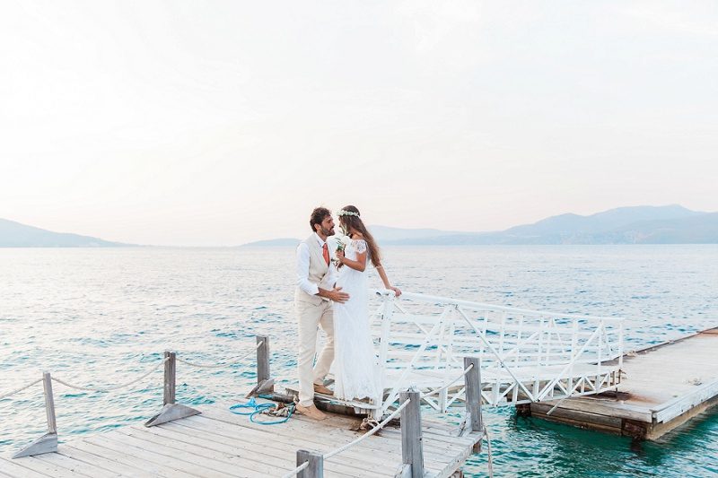 Couple Sharing a Moment on the Jetty at Ionian Blue Hotel