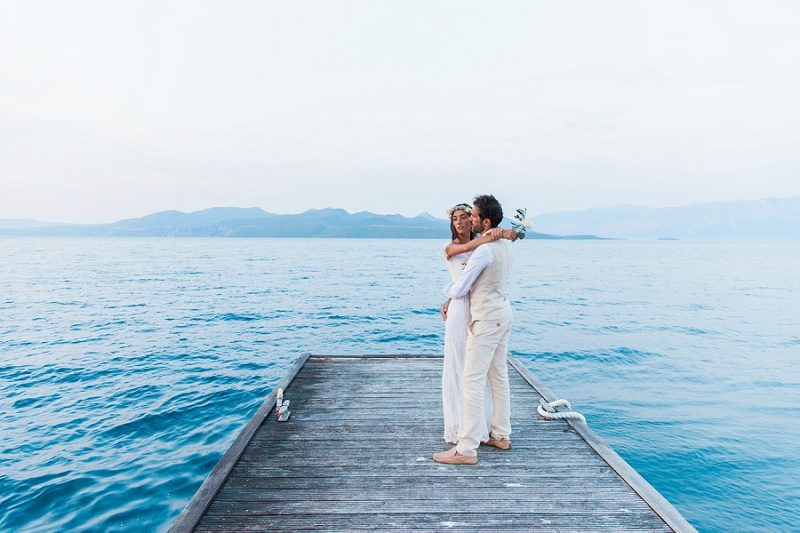 Couple Sharing a Romantic Moment Against the Backdrop of the Ionian Sea