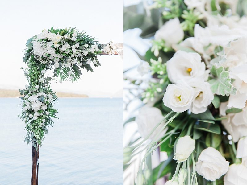 Arch And Flowers In White For a Seaside Elopement