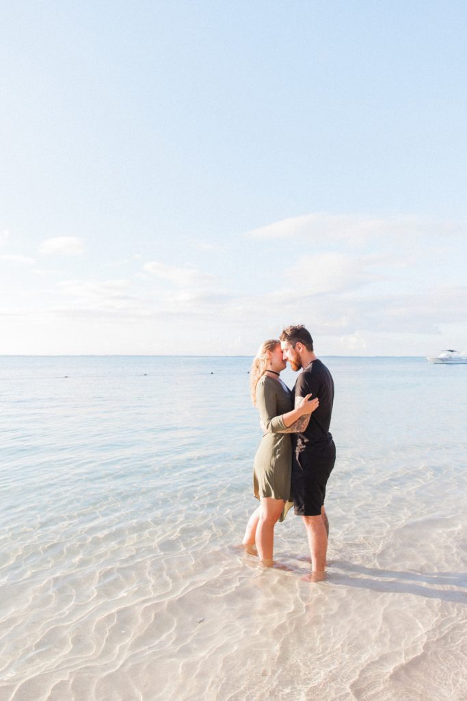 Couple sanding in the Indian Ocean during their Mauritius engagement session