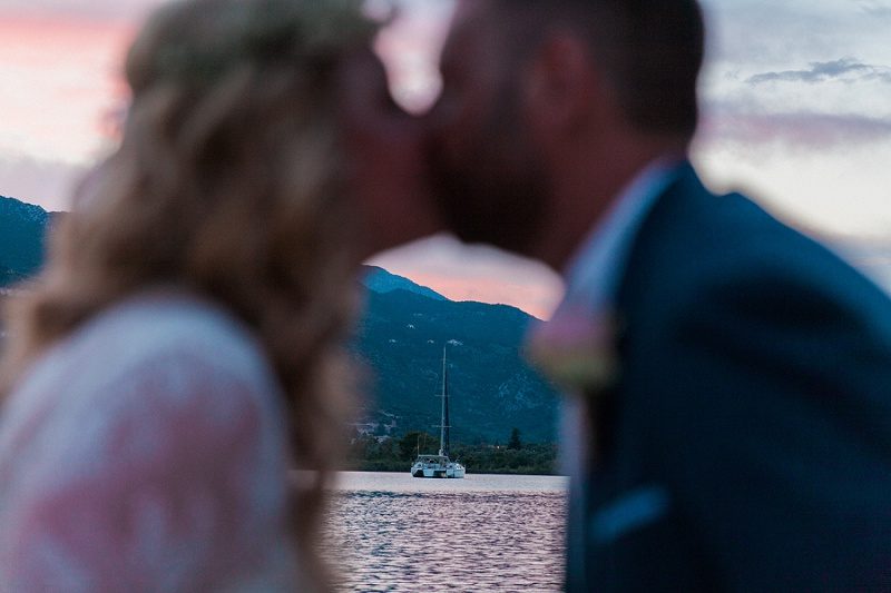 Bride and Groom Kissing on the Jetty at SeaSide Restaurant