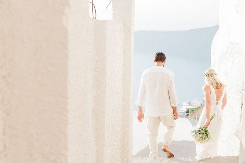 Newlyweds Walking Through The Streets of Fira Santorini