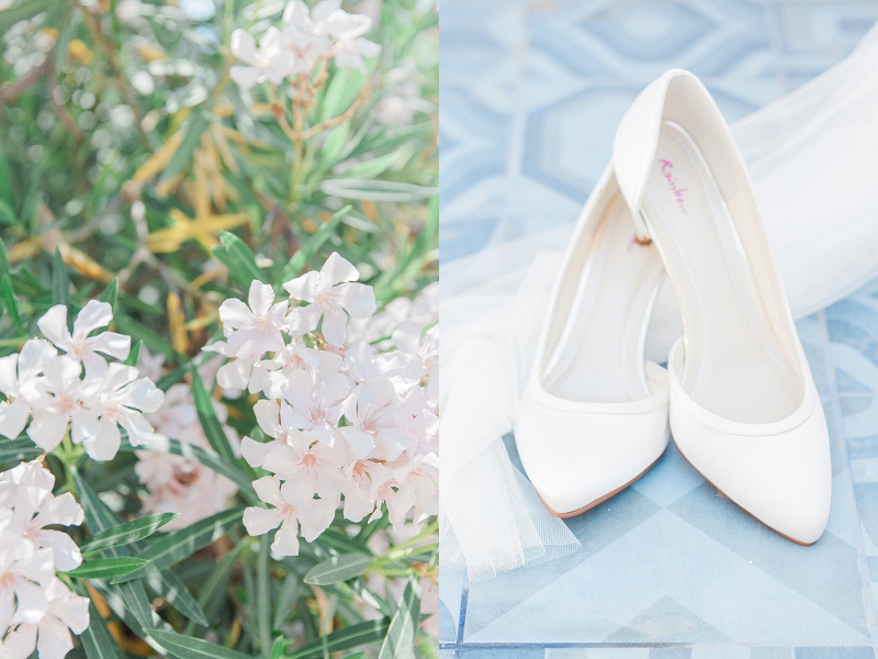 Brides white high heels and veil against blue tiles