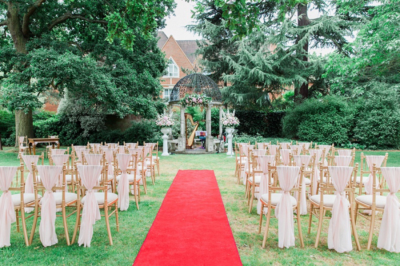 Ceremony Gazebo with Red Carpet and chairs set up for Gracia and Ravi's Wedding at Warren House