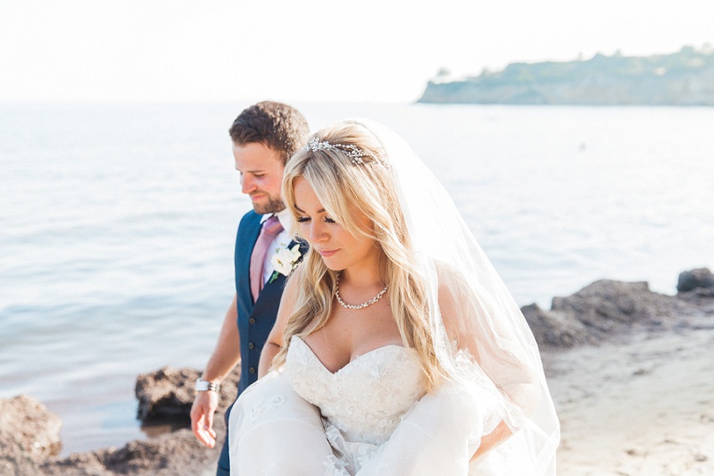 Bride and Groom walking down the beach together on Kefalonia