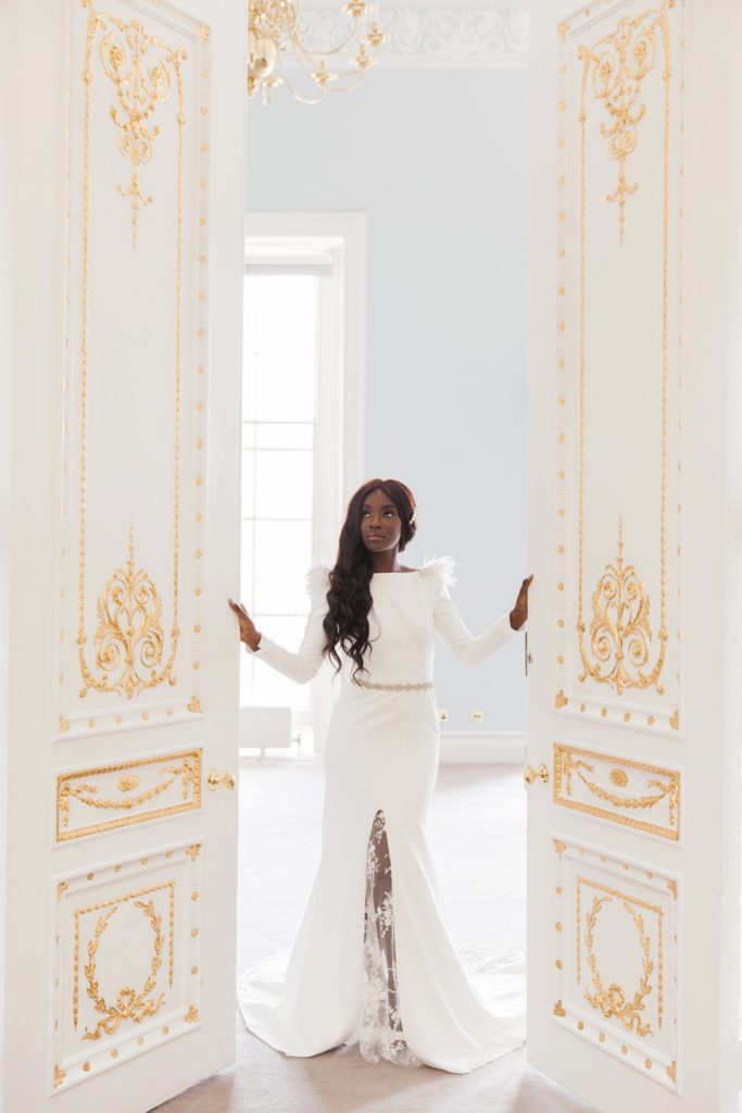 Bride opens the ornate doors of 10-11 Carlton House Terrace on the day of her wedding