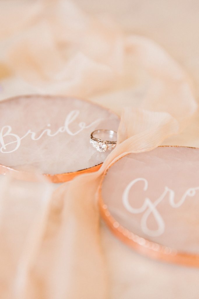 Diamond engagement ring by London Victoria Ring Company and calligraphy rose quartz slices by Scritto