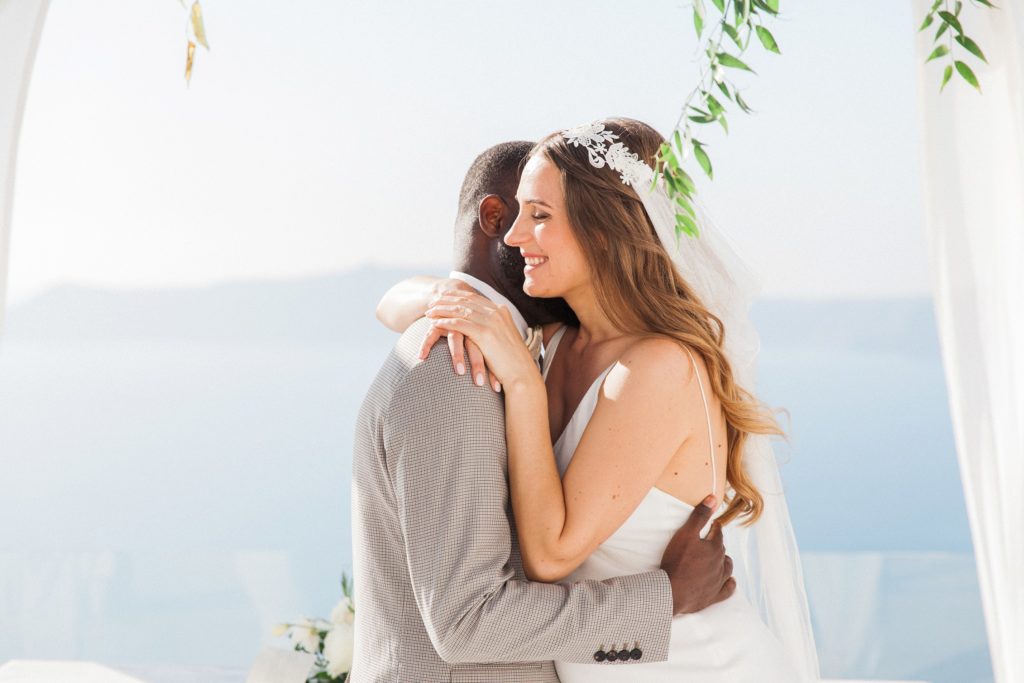 Couple hug after their elopement at Dana Villas Santorini