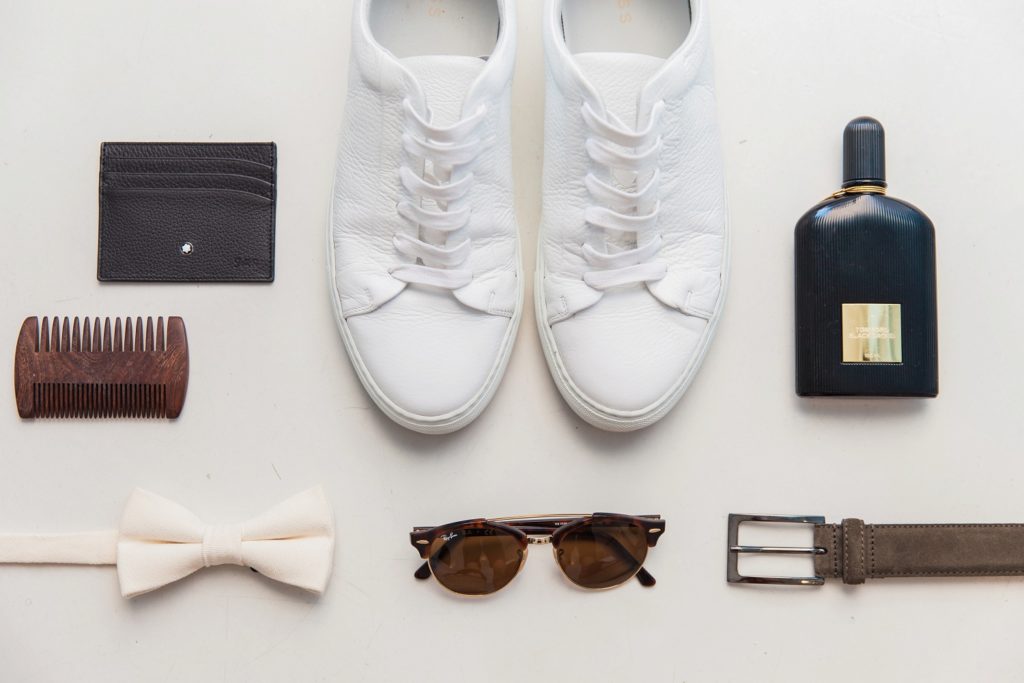 Flatlay of the Grooms details featuring Tom Ford fragrance, Reiss shoes and a bowtie