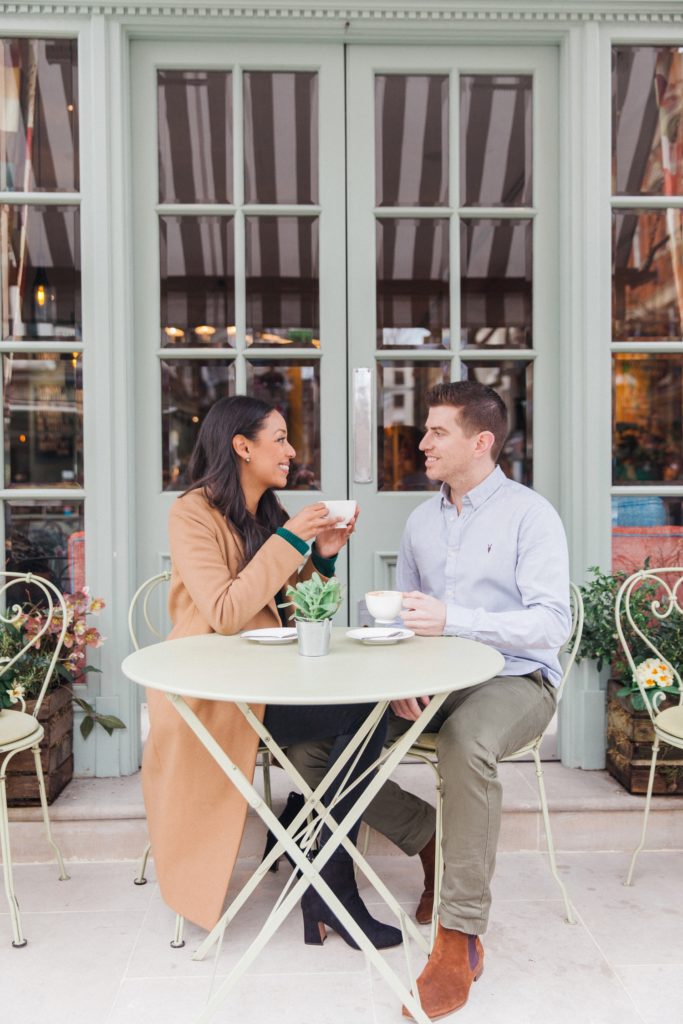 Couple enjoy a cappuccino during their Charlotte Street Hotel engagement session