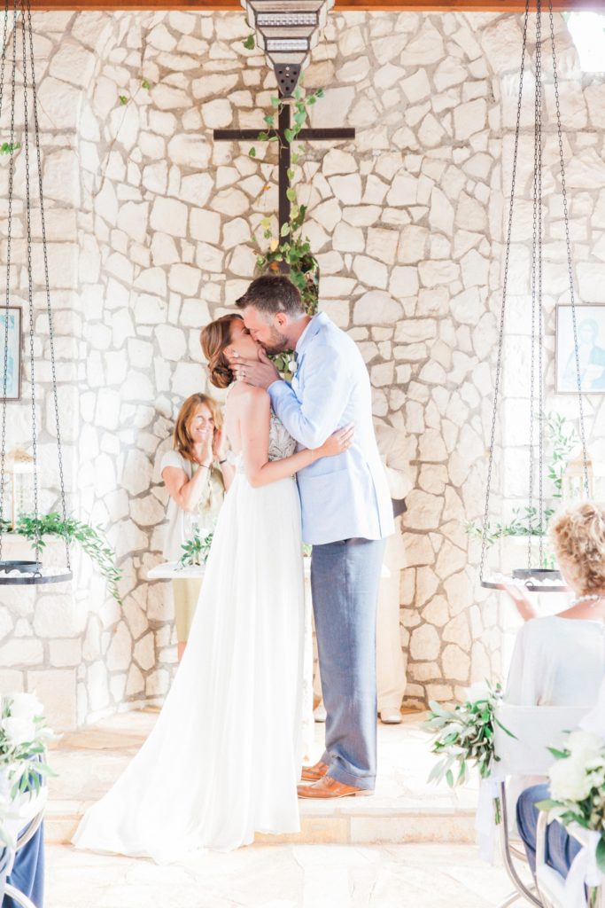 Couples first kiss as man and wife in the Emelisse Hotel wedding chapel on Kefalonia
