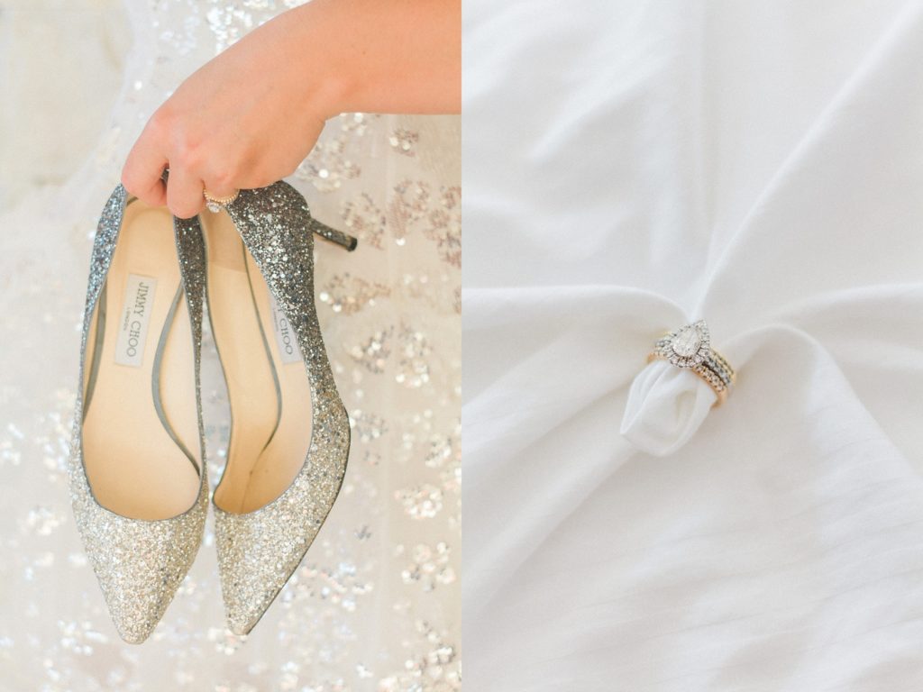 Sparkling blue and silver Jimmy Choo heels next to a Cartier diamond ring