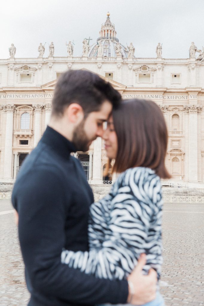 St. Peter's Basilica with a Roman couple blurred in the foreground