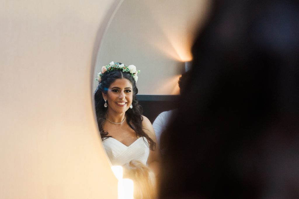 Bride admires her make-up and hair on the morning of her wedding in Egypt