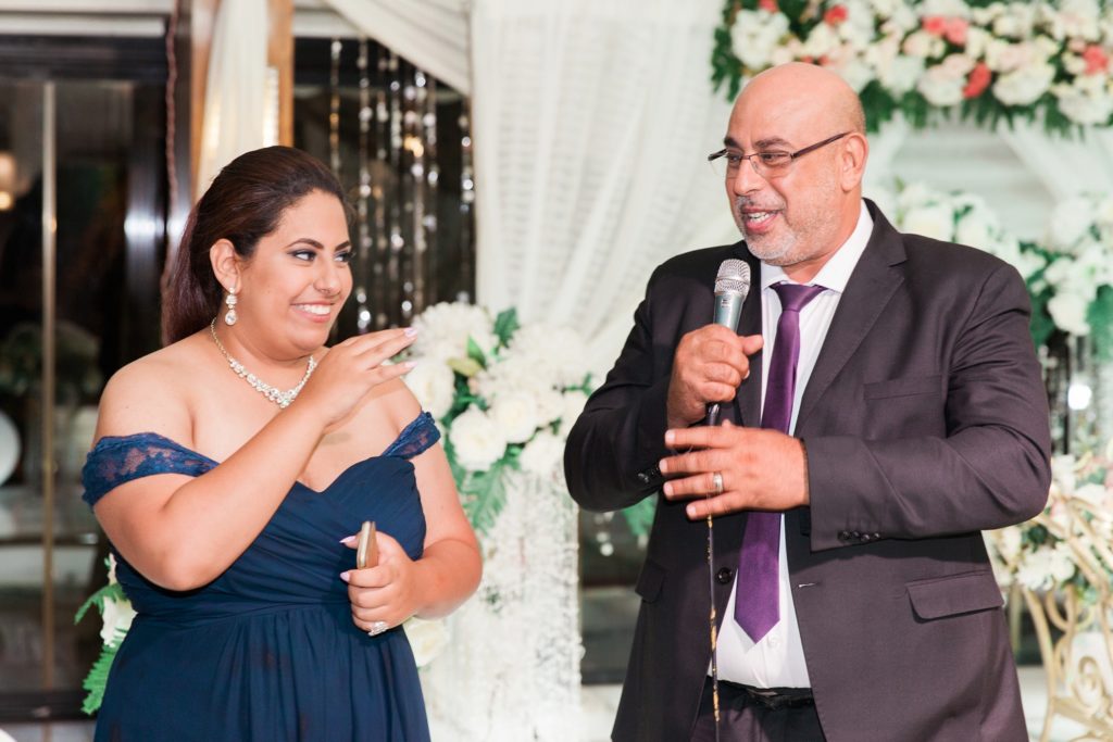 Maid-of-honour and Father-of-the-bride laugh during the speeches at Plein Air wedding venue in Cairo