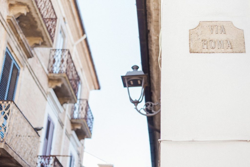 A lamp and street sign in the Italian village of Chieuti in Apulia