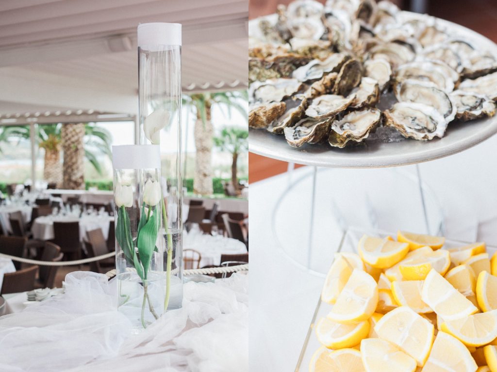 White tulips and lilies in vases and oysters with lemon at a wedding at the Convivium Hotel in Vasto