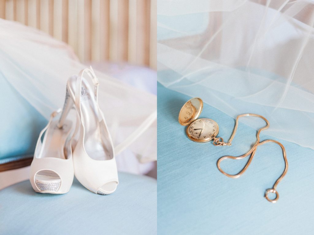 Detail image of the brides wedding shoes and a gold pocket watch