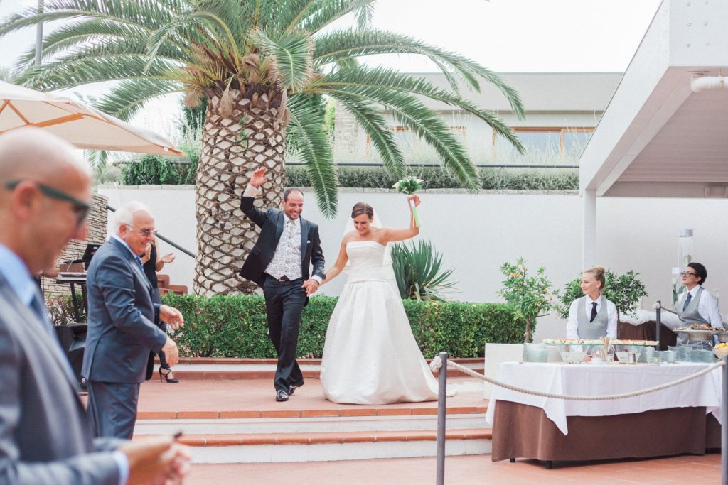 Italian couple make their entrance to their wedding reception at the Convivium Hotel in Abruzzo