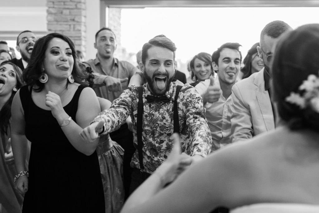 Wedding guests dance during a reception at the Convivium Hotel in Abruzzo