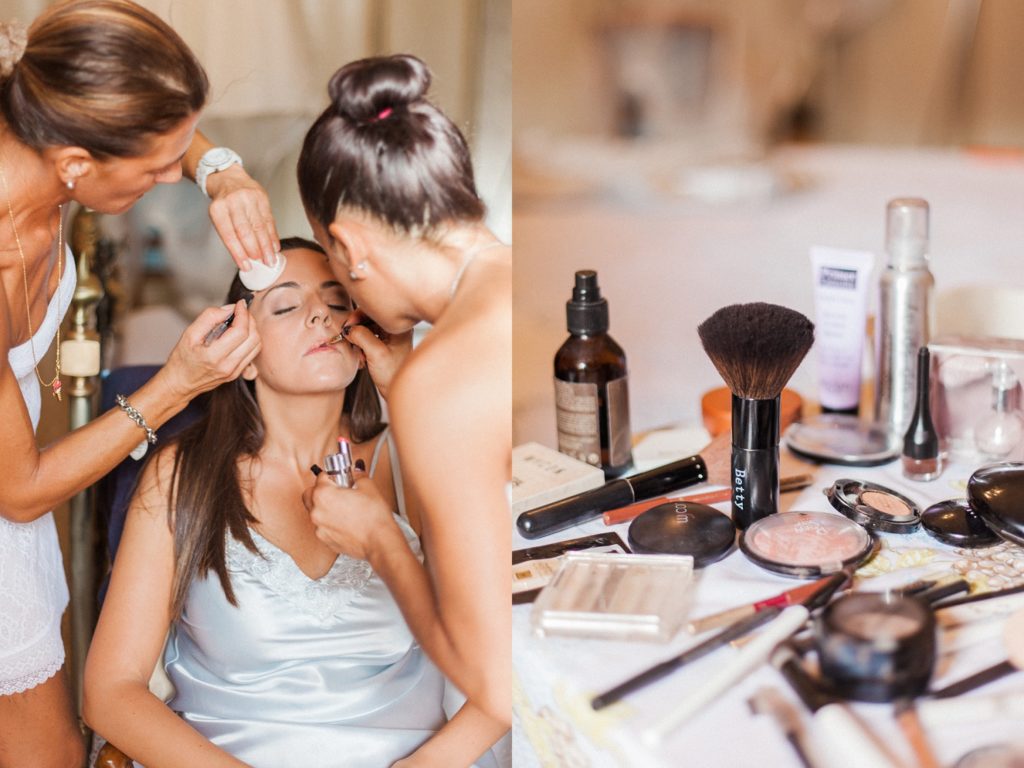 Italian bride having her make-up applied by two make-up artists on the morning of her wedding in Abruzzo
