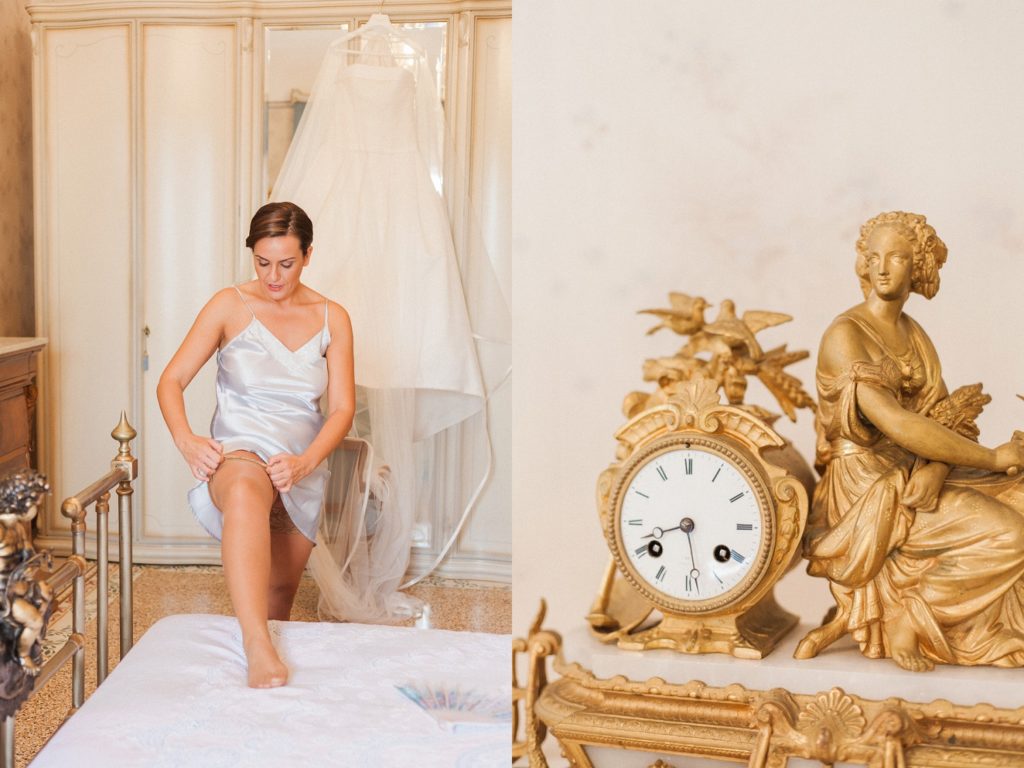 Gold antique clock shows the time as the bride puts on her garter on her wedding morning