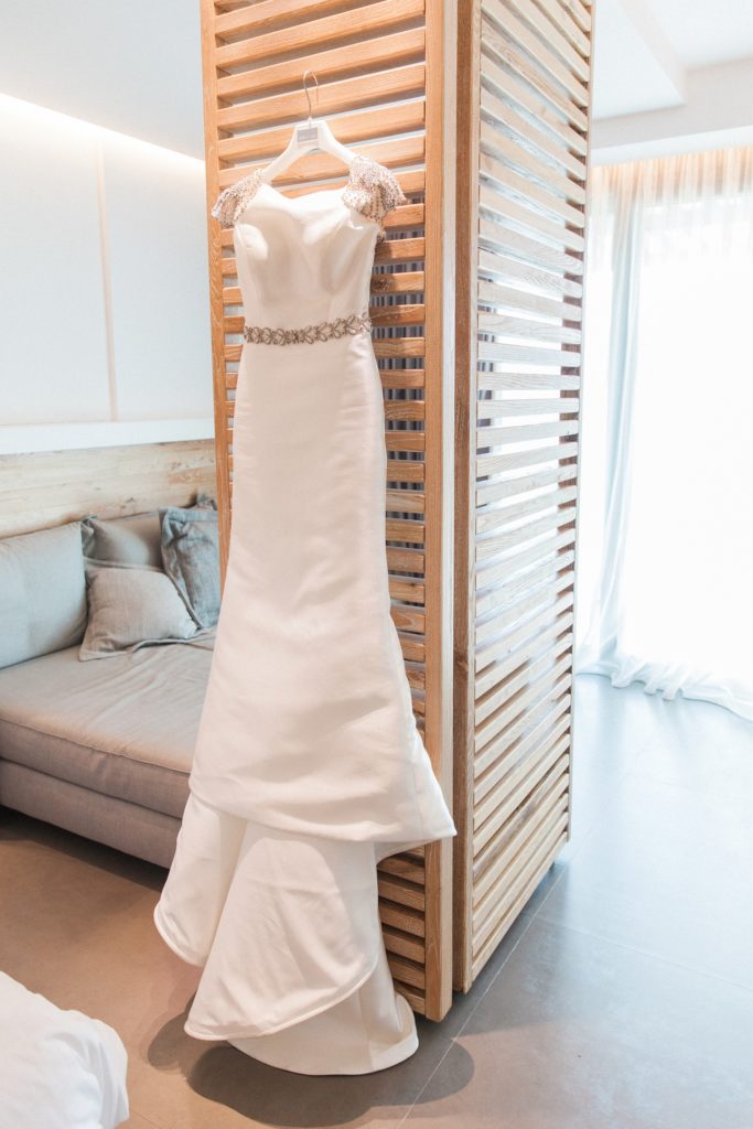 Rosa Clara wedding dress hanging in a suite at Domotel Agios Nikolaos in Sivota