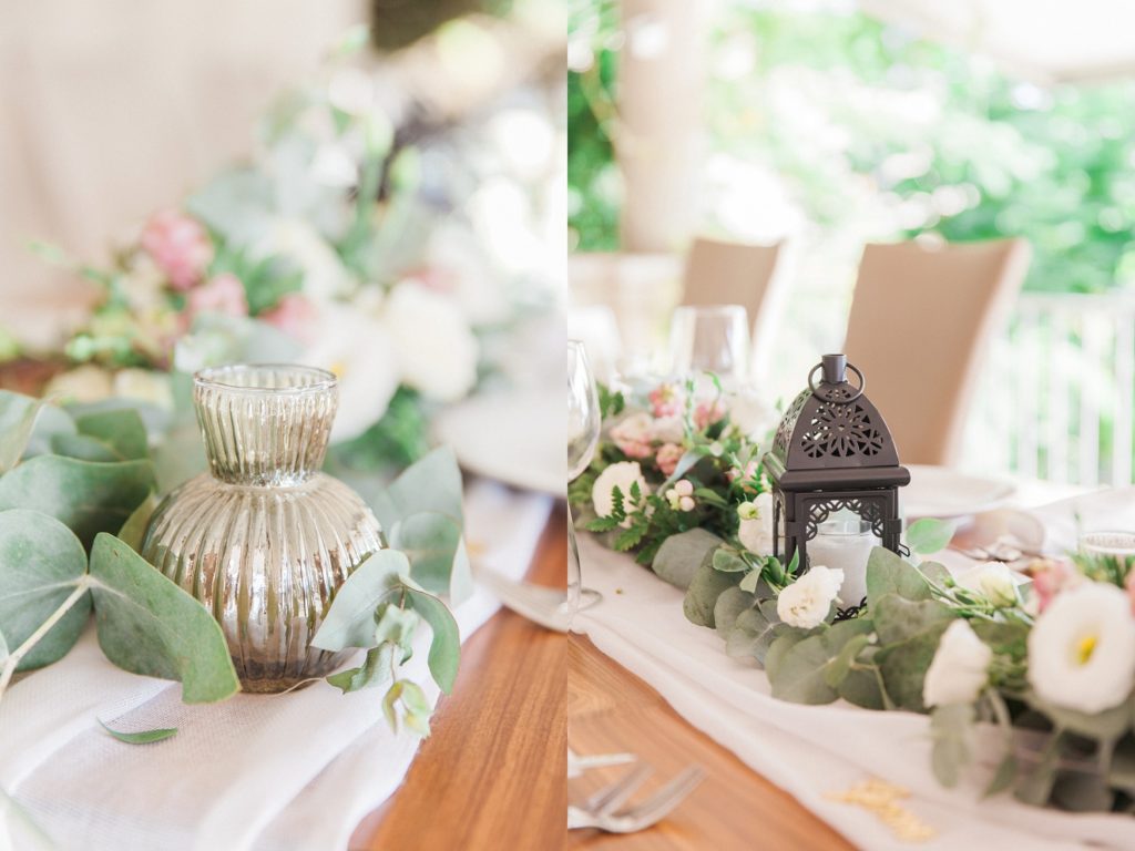 Wedding centrepiece detail images featuring a small mirrored vase, a black lantern and pink and white flowers