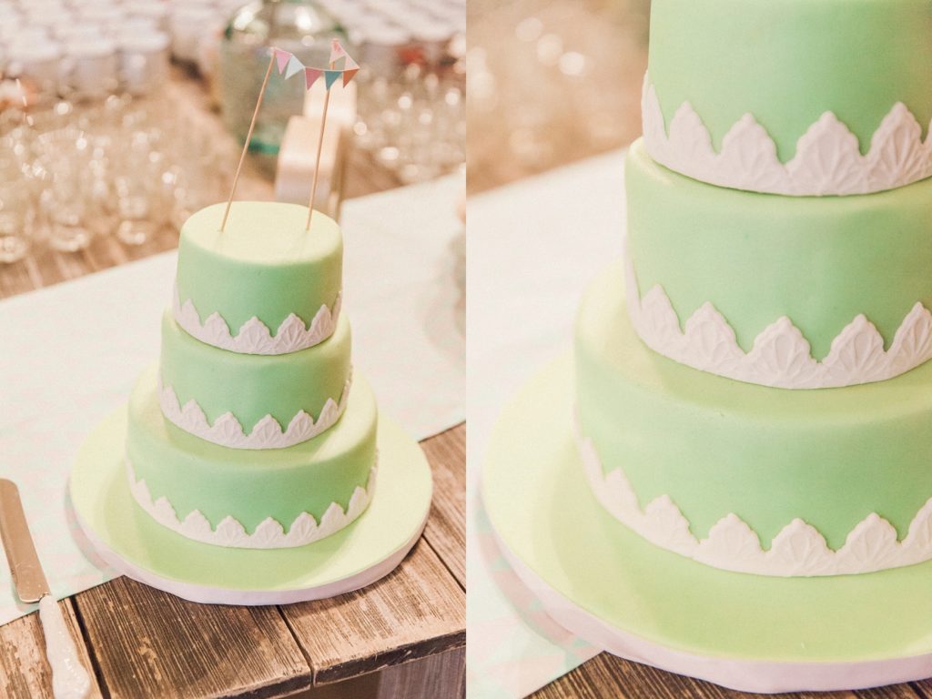 Mint green wedding cake with white sugar lace details