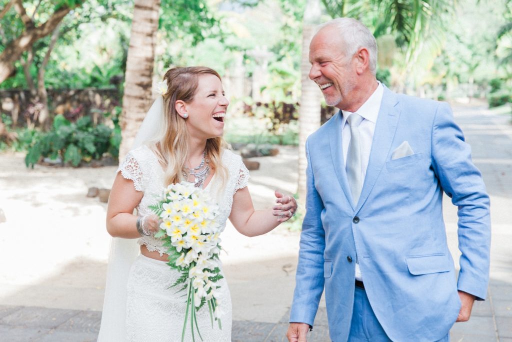 Bride and her father share a laugh before they walk down the aisle