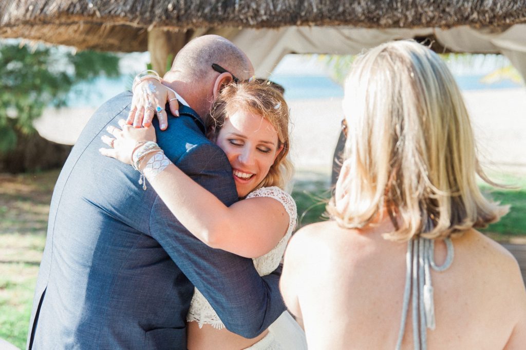 Bride hugs her new father-in-law after her destinaton wedding ceremony in Mauritius
