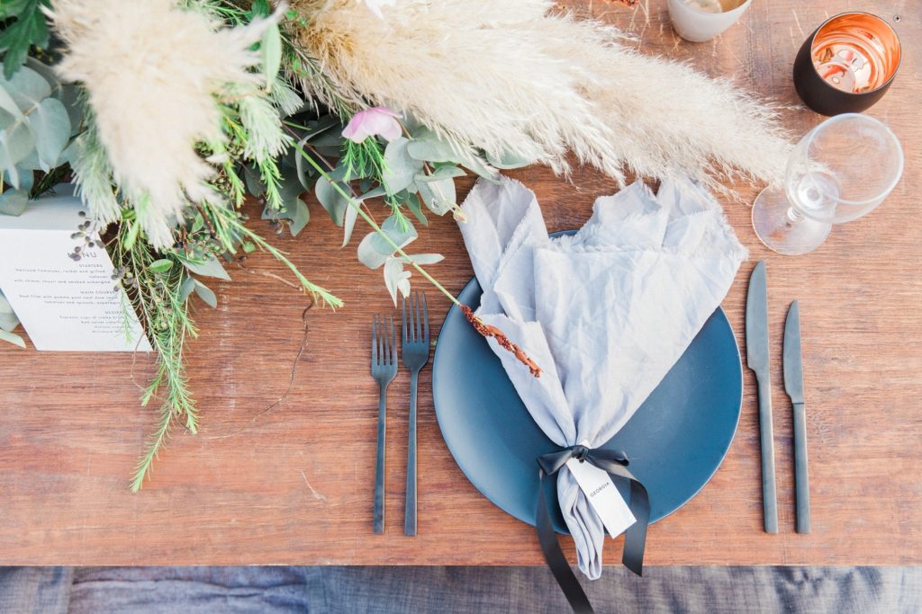 Bohemian table setting with matte black cutlery in the Red Desert