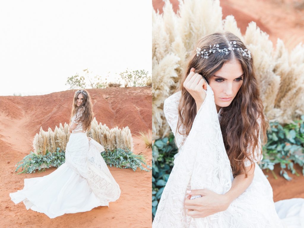 Bride poses in front of her pampas and eucalyptus wedding arch in the Red Desert
