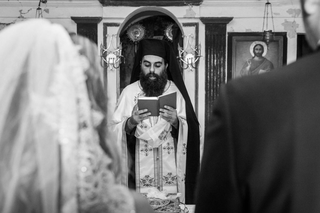 Greek Priest during the traditional Greek wedding ceremony