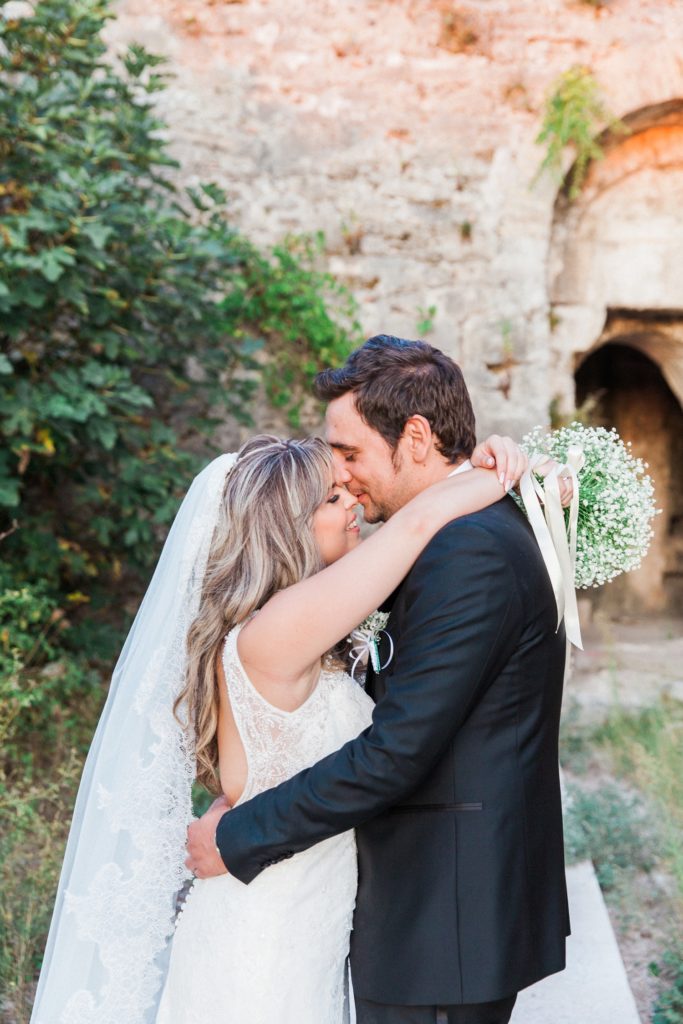 Bride and groom share a moment after their wedding at Santa Maura Castle in Lefkada