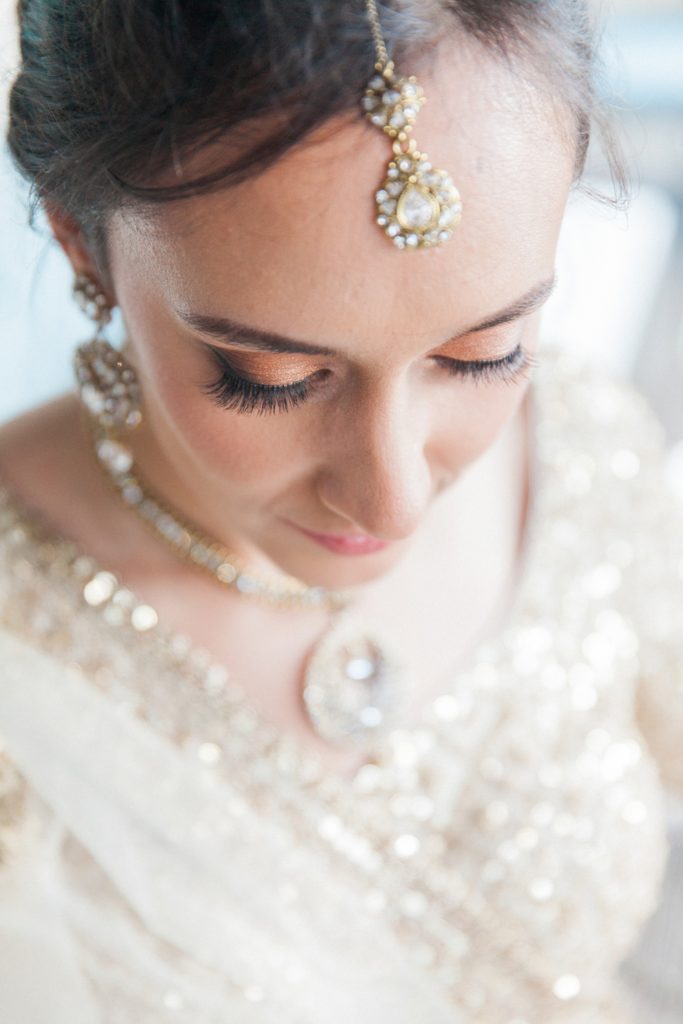 Portrait of an Indian bride showing her make up and traditional Indian jewellery