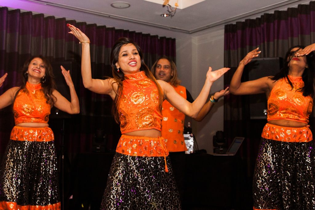Performers from Dance With Jay Kumar entertaining guests at a South Place Hotel wedding
