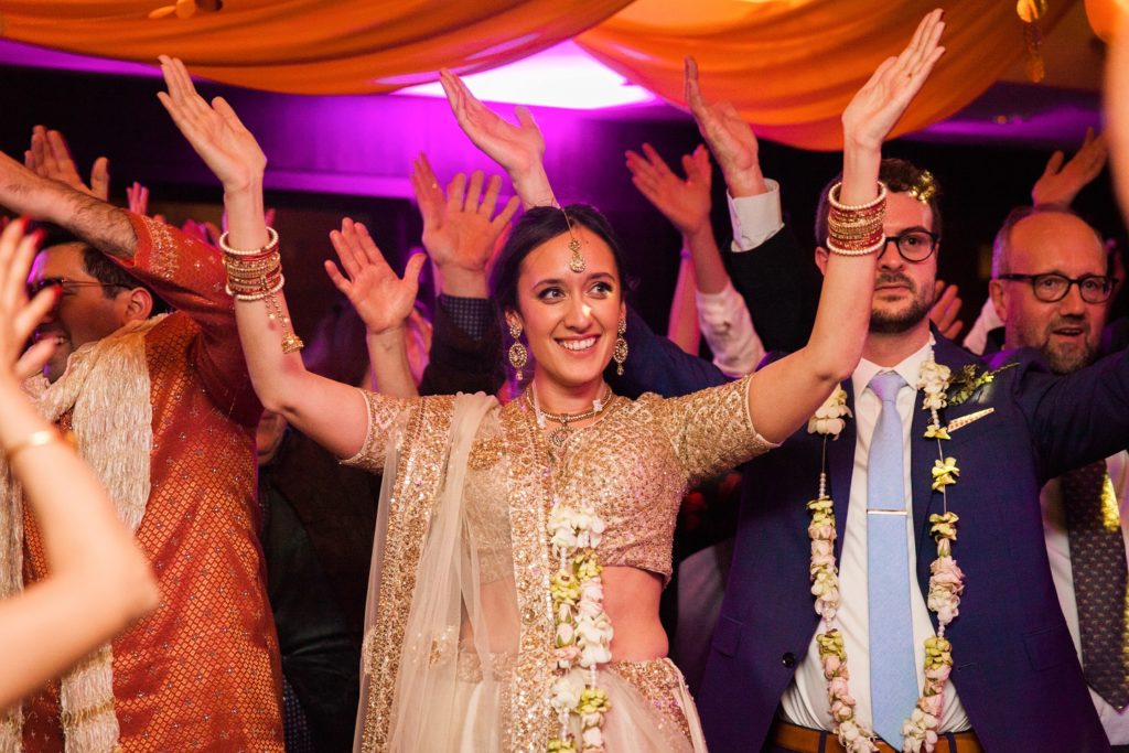 Indian bride dances during her wedding at South Place Hotel in London