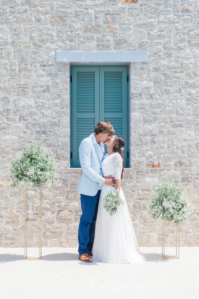 Couples first kiss after their villa elopement in Greece