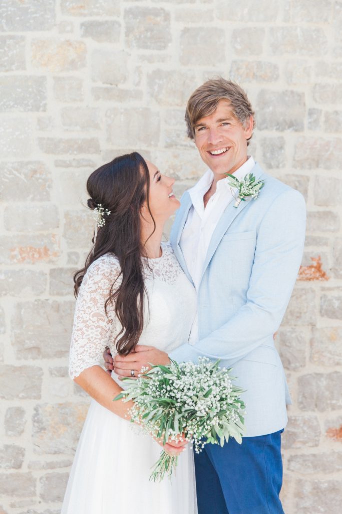 Couple smile after their villa elopement ceremony in Greece