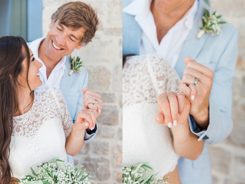 Couple share a laugh while making a 'pinky promise' on their wedding day