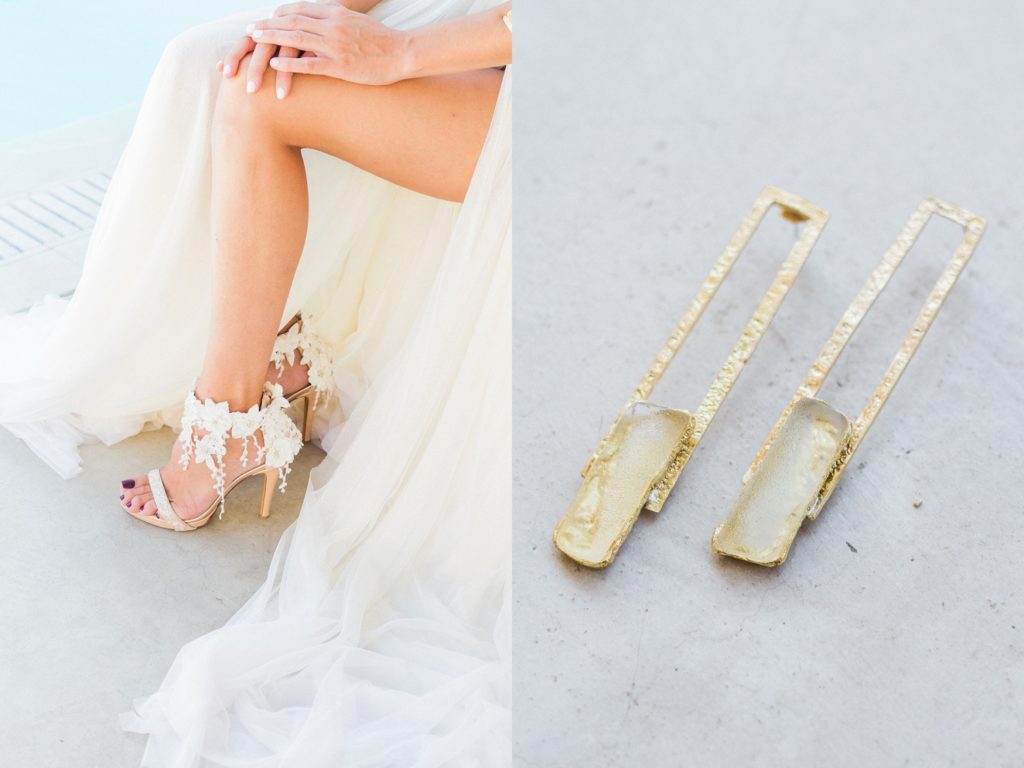 Bride wears an Atelier Zolotas gown and a pair of Katerina Savrani heels with a pair of gold and stone earrings