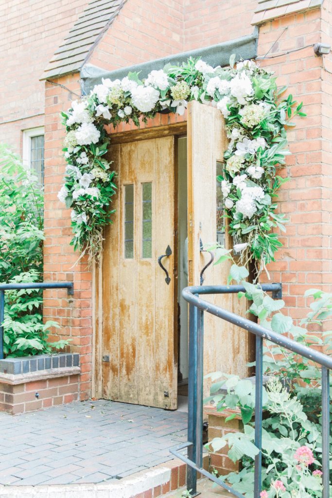 Ivy and hydrangea garland above the door of an English church