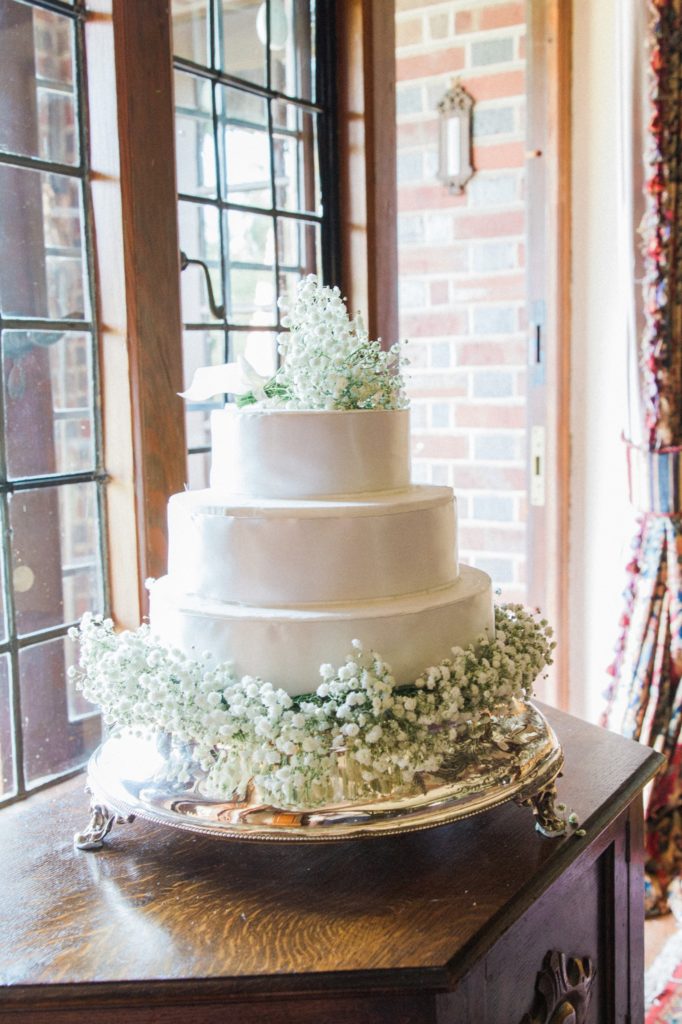 White wedding cake with gypsophila topper