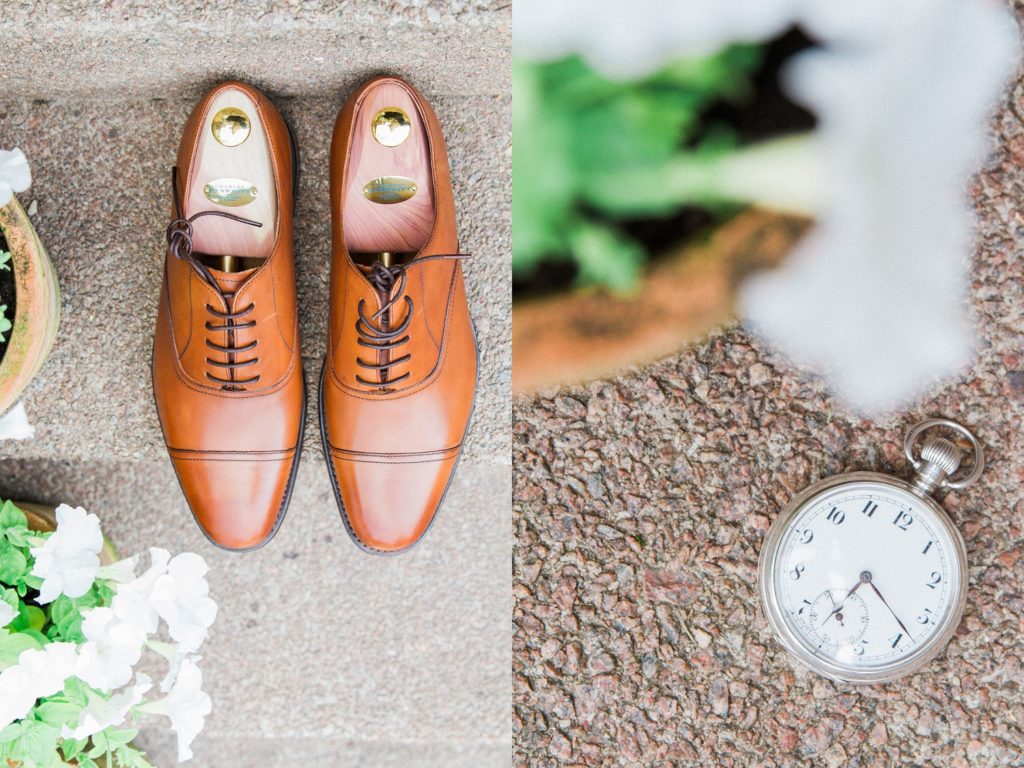 Detail image of the grooms leather shoes and pocket watch