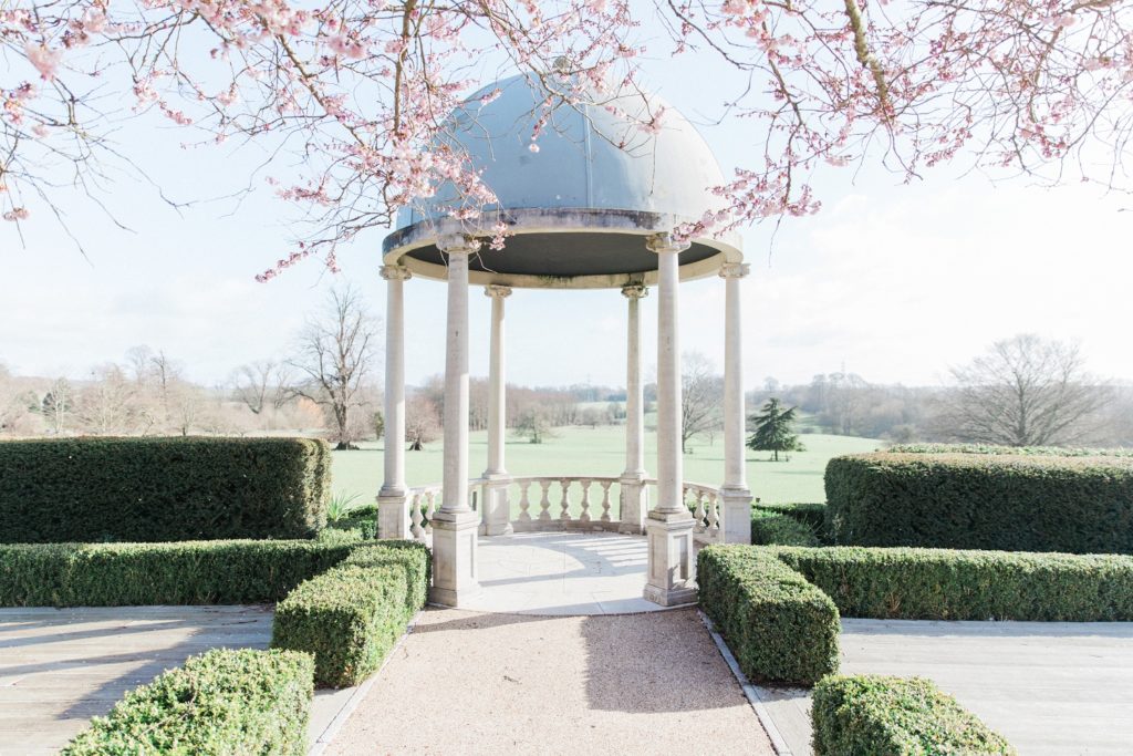 Wedding gazebo with cherryblossoms in the manicured gardens of Froyle Park
